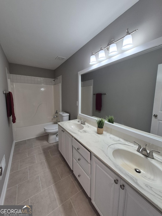 full bathroom with toilet, tile patterned flooring, vanity, and tub / shower combination