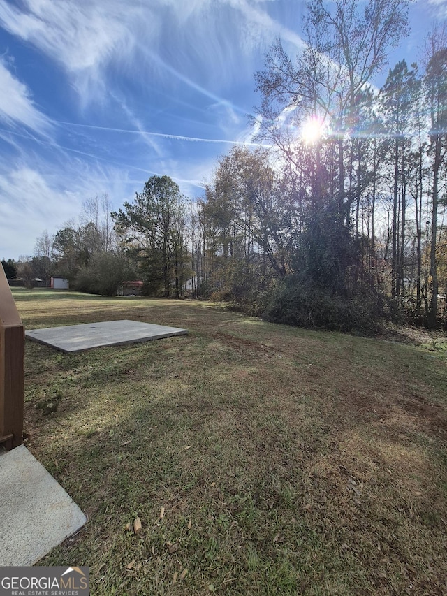 view of yard featuring basketball court