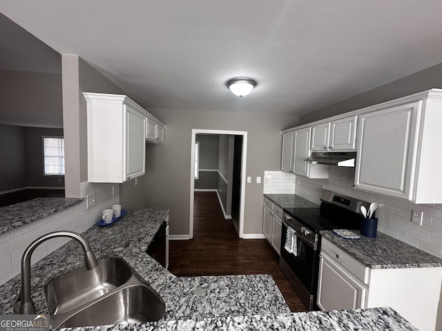 kitchen with backsplash, sink, white cabinetry, and stainless steel range with electric cooktop