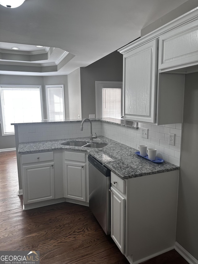 kitchen featuring white cabinets, dishwasher, dark hardwood / wood-style floors, and sink