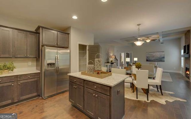 1721 Cobblefield Cir, Dacula, GA 30019 - kitchen with stainless steel fridge, dark wood-style floors, open floor plan, light countertops, and a ceiling fan