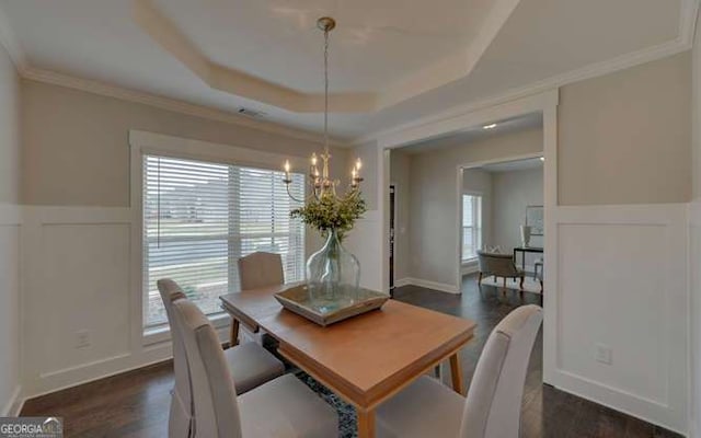 1721 Cobblefield Cir, Dacula, GA 30019 - dining room with a chandelier, dark wood-type flooring, wainscoting, a decorative wall, and crown molding