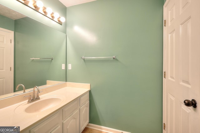 bathroom featuring vanity and baseboards