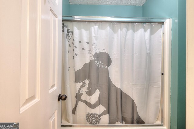 bathroom with a textured ceiling