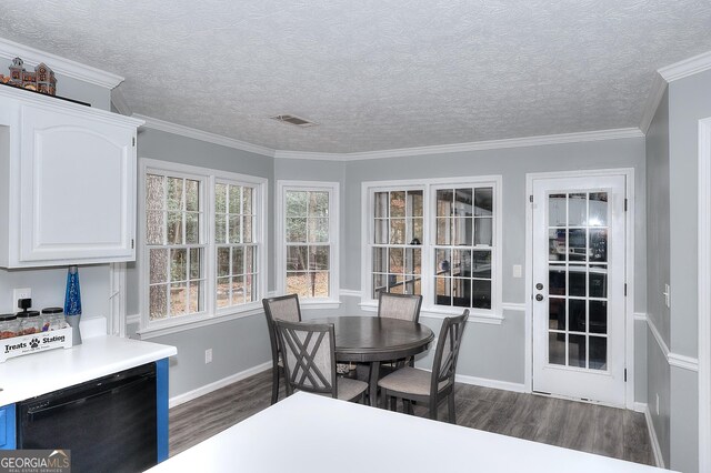 dining space with ornamental molding, a textured ceiling, and dark wood-type flooring