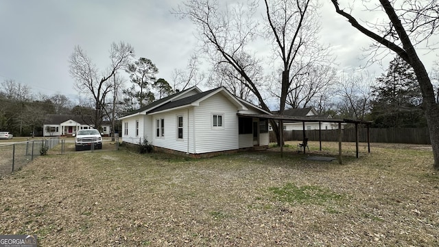 view of home's exterior featuring a carport