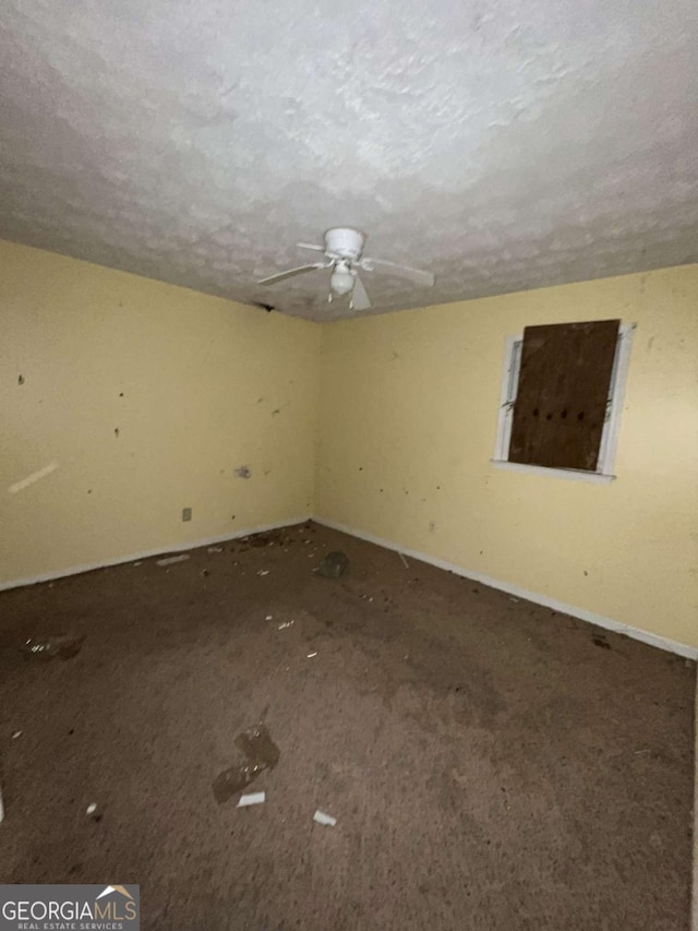 empty room featuring a textured ceiling