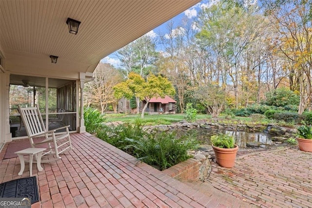 view of patio with a sunroom