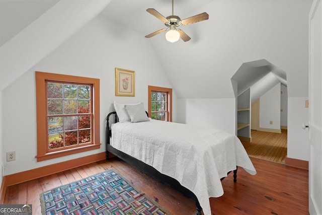 bedroom with hardwood / wood-style floors, ceiling fan, and lofted ceiling