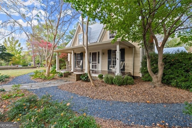 farmhouse inspired home featuring a porch