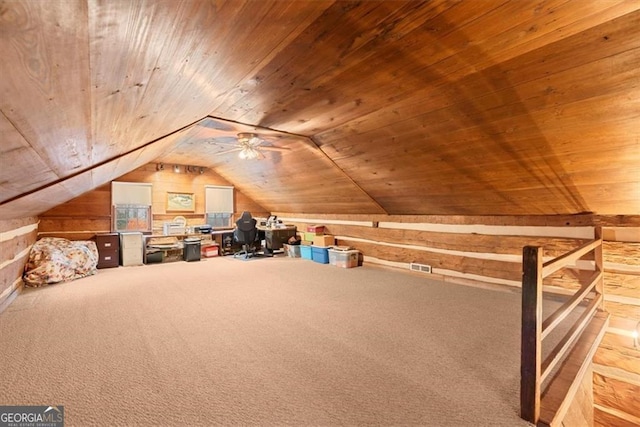 additional living space featuring carpet flooring, vaulted ceiling, wooden walls, and wood ceiling