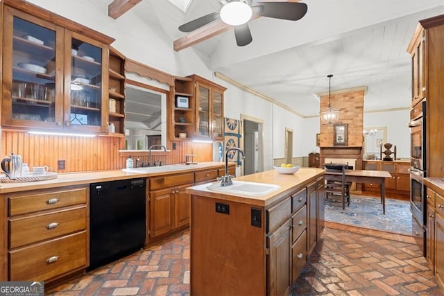 kitchen featuring pendant lighting, a kitchen island with sink, sink, vaulted ceiling with beams, and black dishwasher