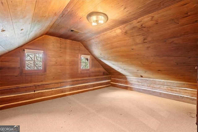 bonus room featuring wood ceiling, carpet floors, a healthy amount of sunlight, and lofted ceiling