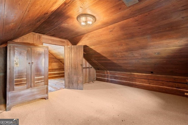 bonus room with wooden walls, wooden ceiling, and lofted ceiling