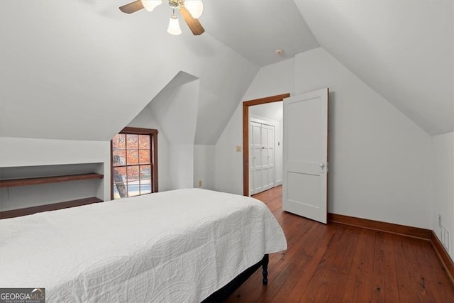 bedroom featuring ceiling fan, vaulted ceiling, and hardwood / wood-style flooring