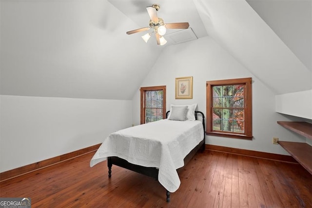 bedroom featuring hardwood / wood-style flooring, ceiling fan, and vaulted ceiling