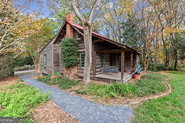 view of property exterior featuring a lawn