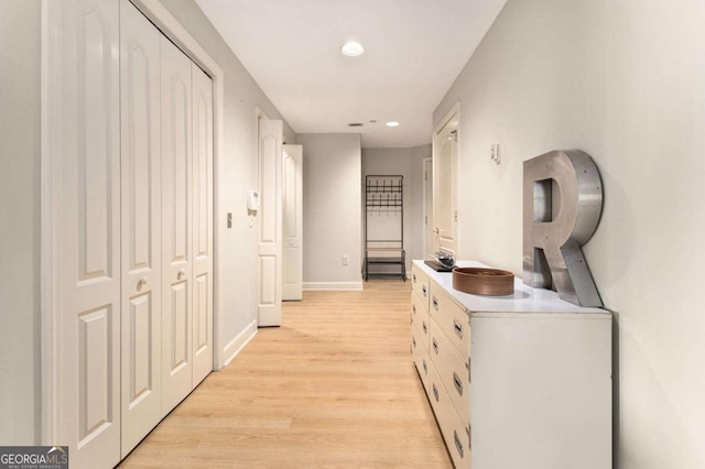 hallway with light wood-type flooring