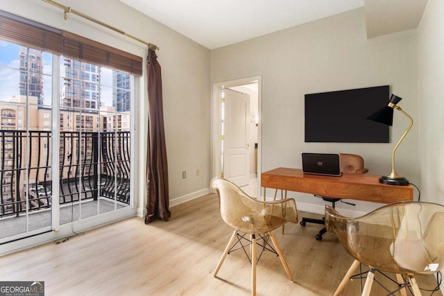 home office with hardwood / wood-style floors