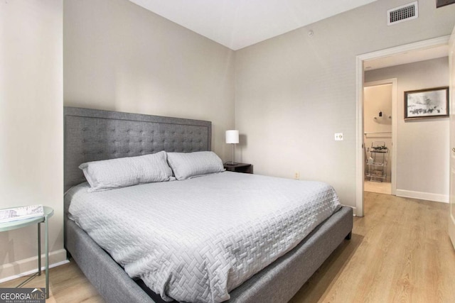 bedroom with light wood-type flooring