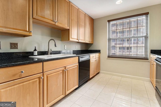 kitchen with dishwasher, sink, light tile patterned floors, dark stone counters, and stainless steel stove