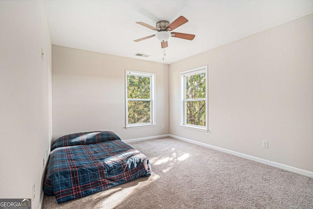 carpeted bedroom featuring ceiling fan