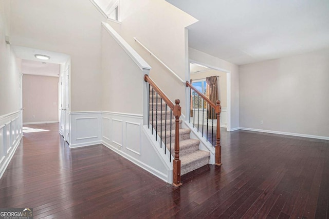 stairs with hardwood / wood-style floors