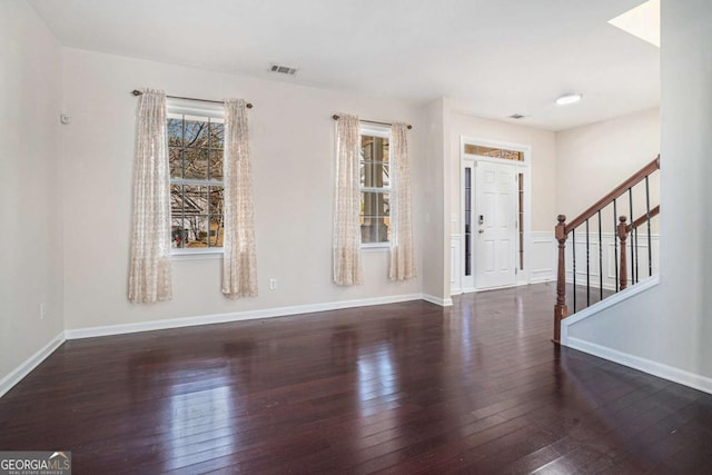 foyer entrance with dark hardwood / wood-style flooring