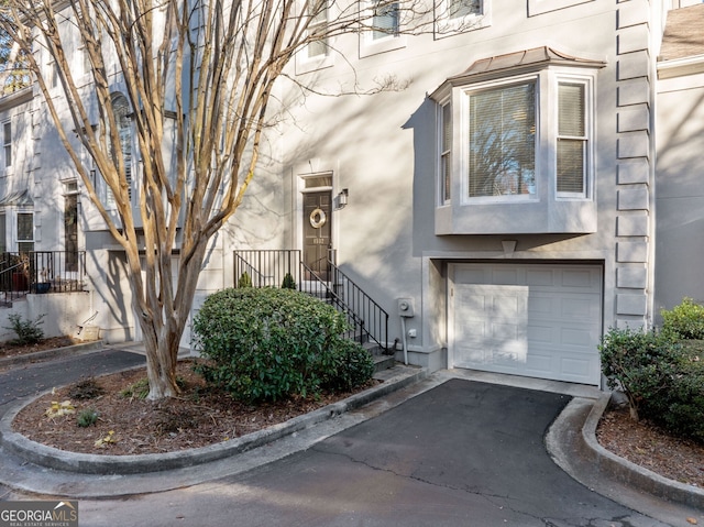 view of exterior entry featuring a garage