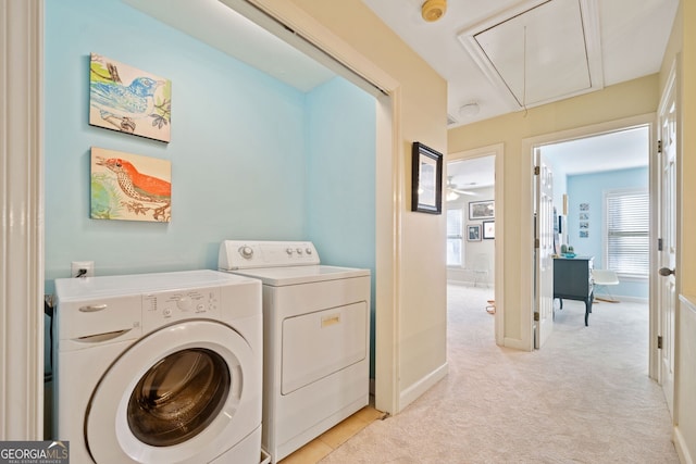 washroom featuring light colored carpet and washer and clothes dryer