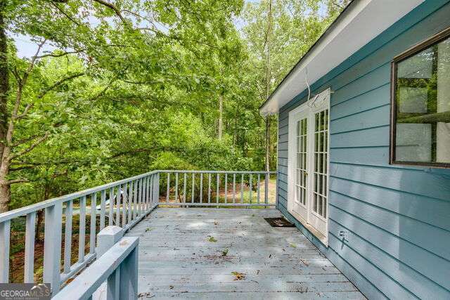 wooden deck featuring french doors