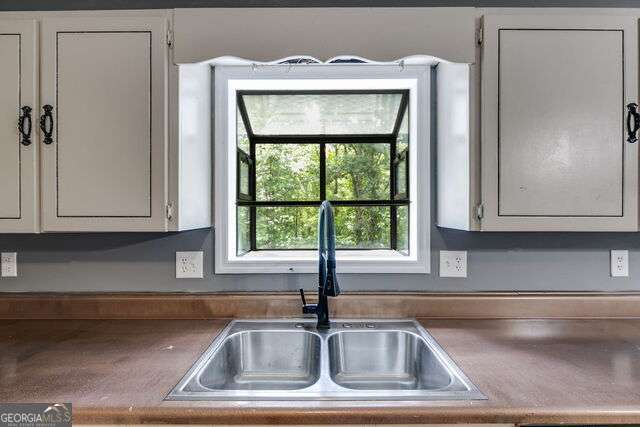 kitchen with white cabinets and sink