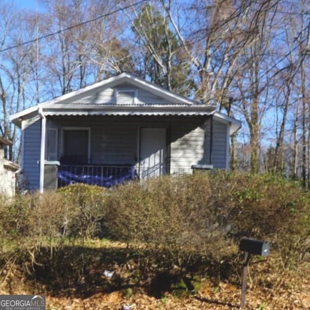 view of home's exterior featuring a porch