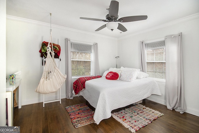 bedroom featuring ceiling fan, dark hardwood / wood-style flooring, and crown molding