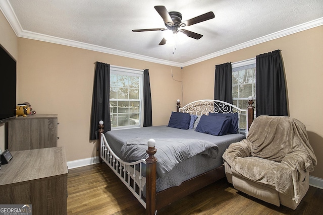 bedroom featuring ceiling fan, dark hardwood / wood-style flooring, crown molding, and a textured ceiling