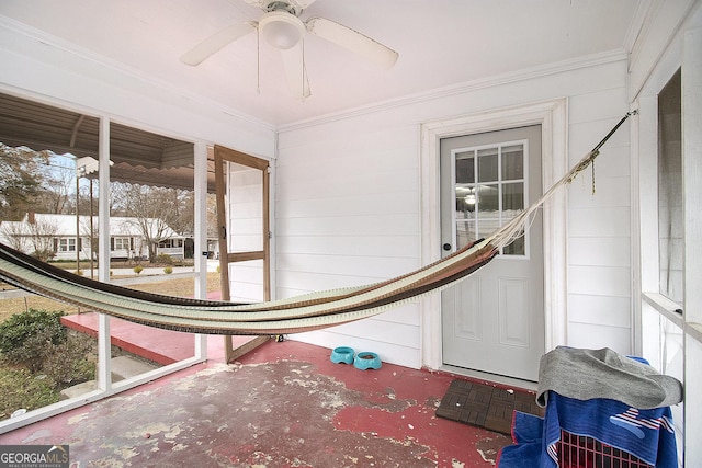 sunroom featuring ceiling fan