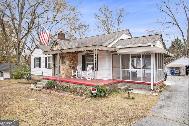 view of front of house featuring an outdoor structure and a garage