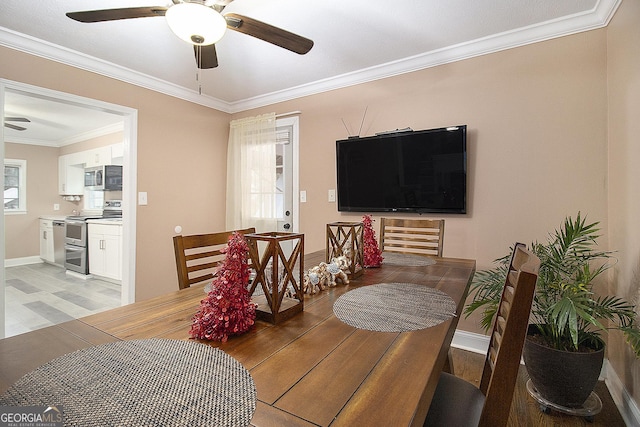 dining room featuring ceiling fan and ornamental molding