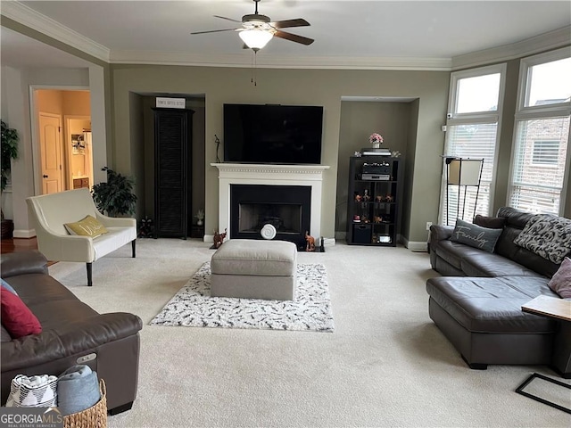 living room with light carpet, ceiling fan, and ornamental molding