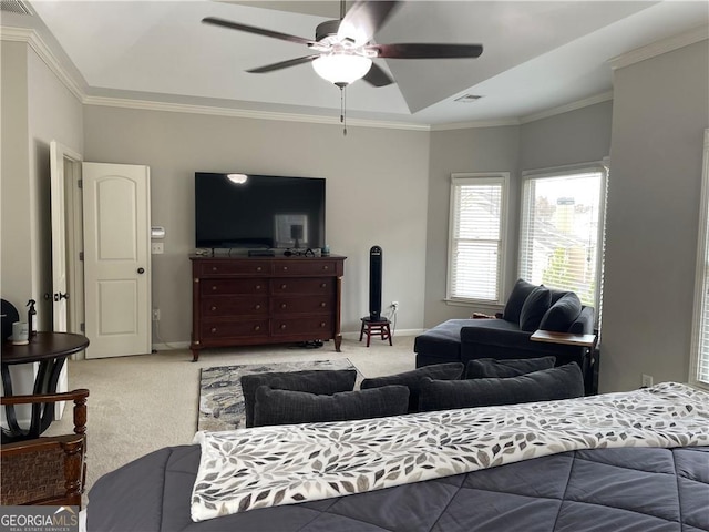 carpeted bedroom featuring ceiling fan and crown molding