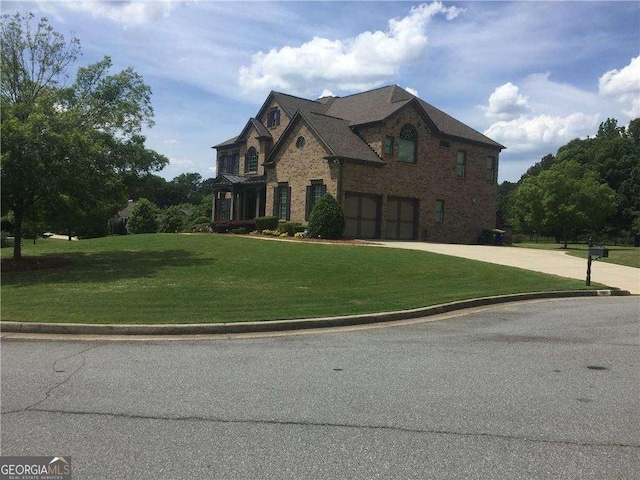 french country inspired facade featuring a front lawn and a garage