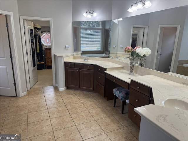 bathroom featuring tile patterned flooring, vanity, and toilet