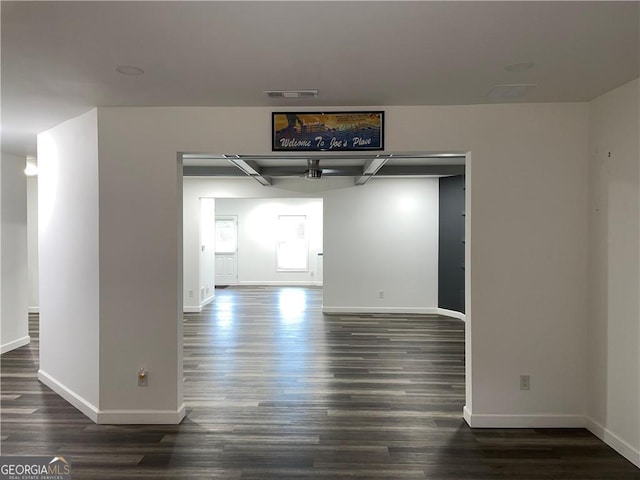 unfurnished room featuring dark hardwood / wood-style flooring