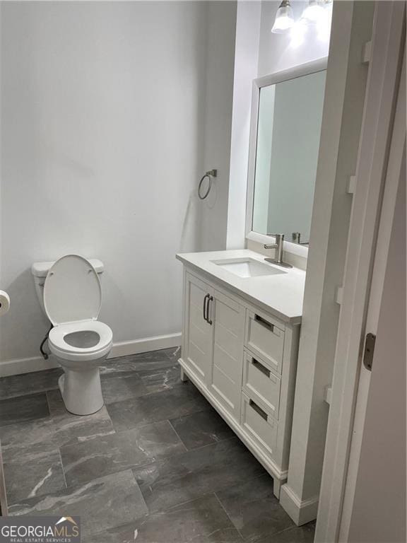 bathroom with vanity and toilet