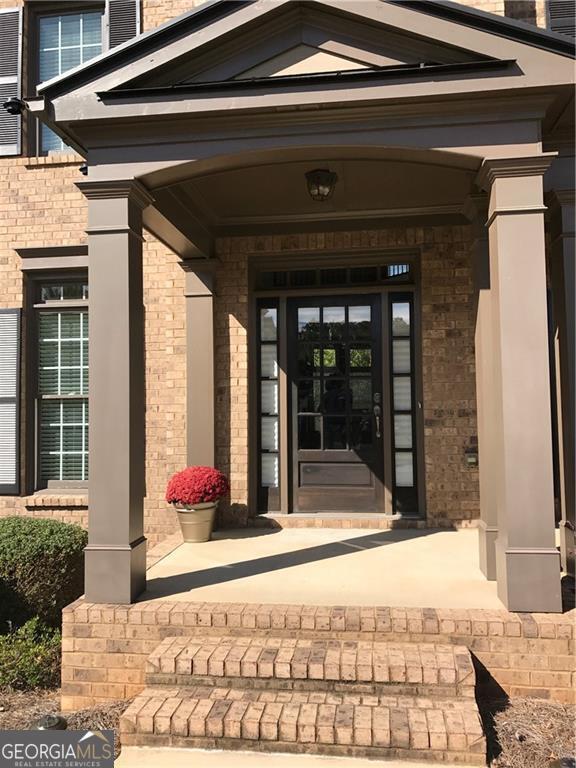 doorway to property with a porch