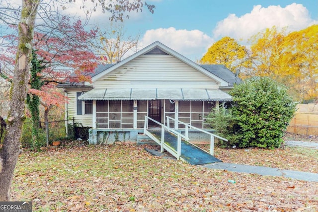 bungalow-style home featuring a sunroom