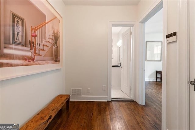 hallway with dark wood-type flooring