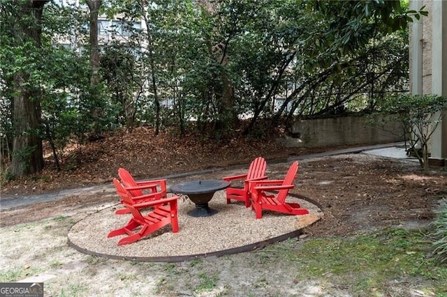 view of yard featuring a patio area and an outdoor fire pit