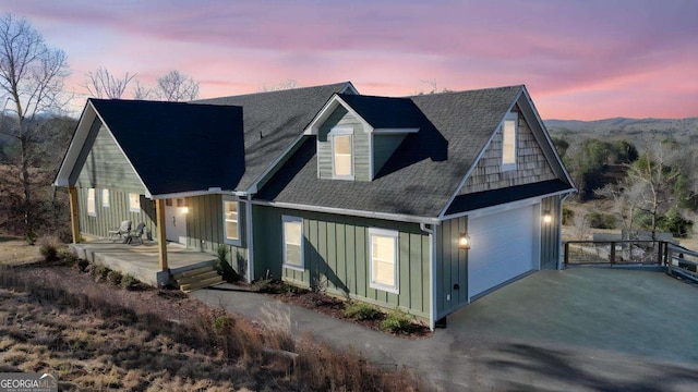 view of front of property featuring a garage and covered porch