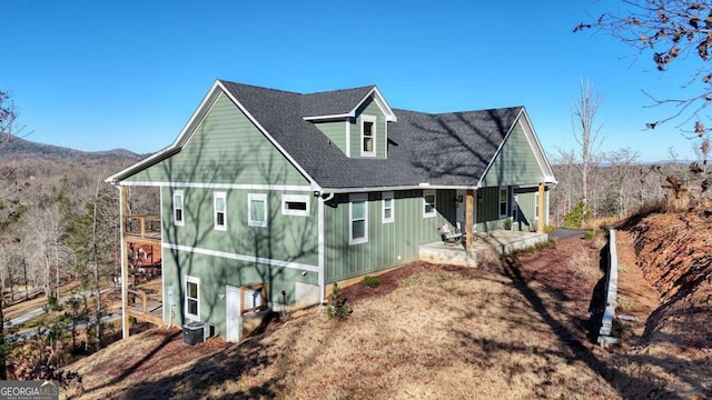 view of side of property with central AC unit